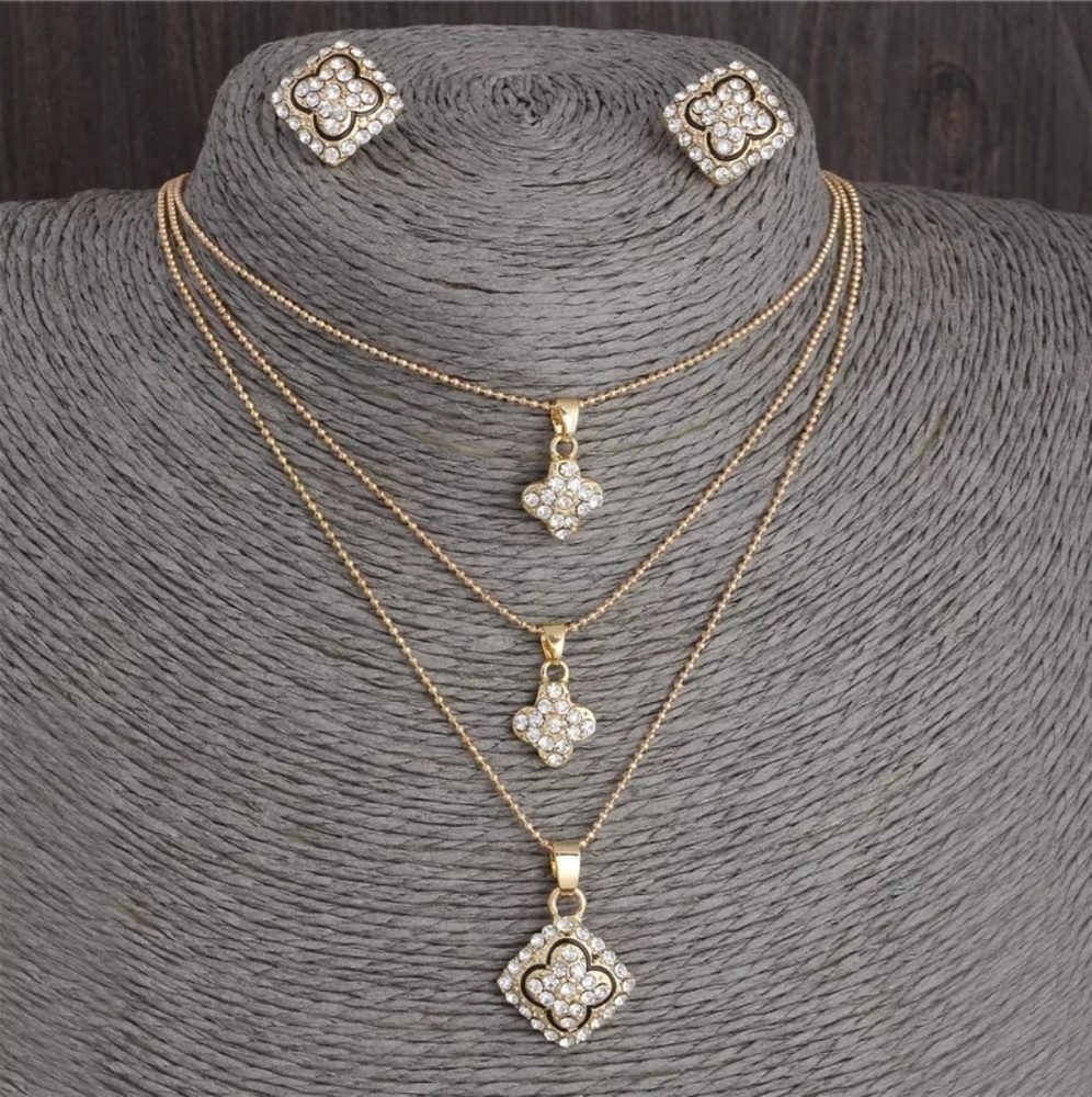 3 necklaces and a pair of matching earrings